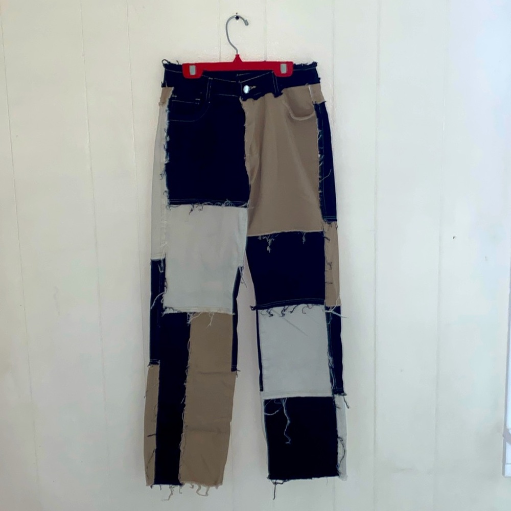 Tri-colored, stretchy, and wide leg jeans.
